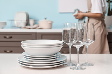 Fototapeta na wymiar Set of clean dishes on table in kitchen