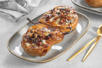 pear and cheese. pear baked with blue cheese, nuts and honey, Delicious balanced food concept. Food recipe background. Close up