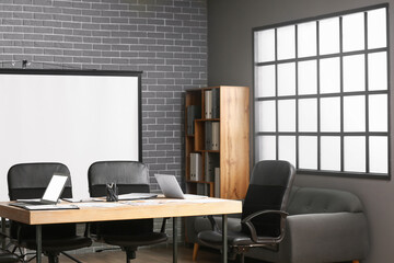 Modern office with projector prepared for conference