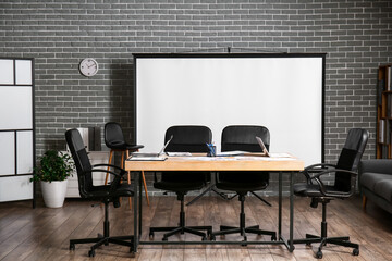 Modern office with projector prepared for conference