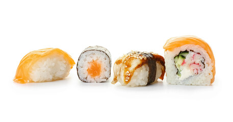 Different sushi and rolls on white background