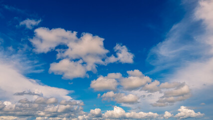 Blue sky fluffy white clouds on summer season bright clear skyline with beautiful cloudscape. Panorama blue sky clouds pattern on daylight with copy space. Cumulus cloudscape air climate sunny day
