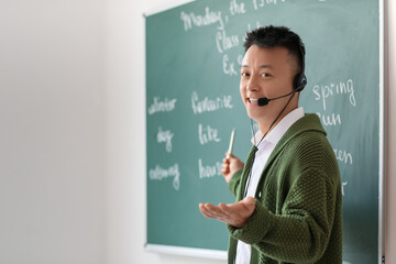 Asian teacher conducting English lesson online