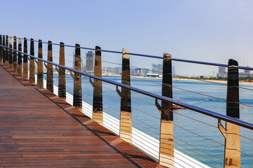Pedestrian hanging bridge over sea in Dubai Marina