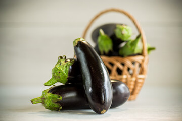 ripe purple eggplant on a wooden background