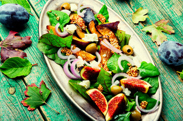 Fototapeta na wymiar Autumn seasonal salad with plums and figs