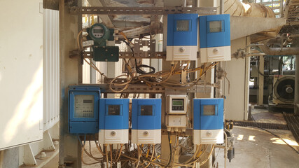 Blue flowmeter converter on rack in factory applicable to a wide range of application and installation.