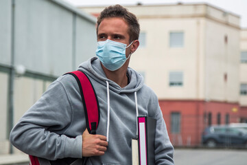 young student in high school with medical mask