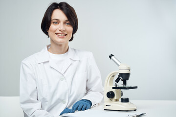 woman scientist laboratory microscope biotechnology research