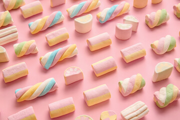 Tasty marshmallows on color background