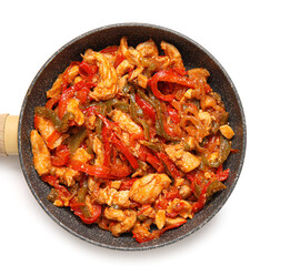 Frying pan with tasty chicken Fajita on white background