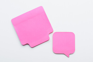 Pink sticky notes on white background