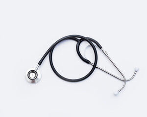 black stethoscope on white background.