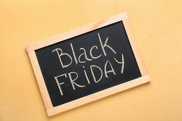 Chalkboard with text BLACK FRIDAY on color background