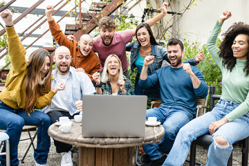 Happy group of friends getting some result online, young people having fun supporting favorite...