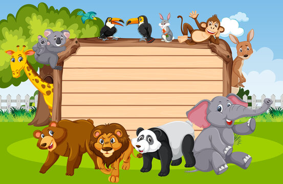 Empty wooden board with various wild animals in the forest