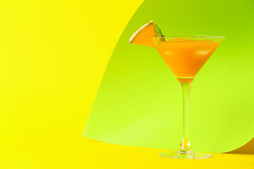 Glass of delicious melon cocktail on color background