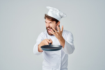 a man in a chef's uniform kitchen utensils Job isolated background