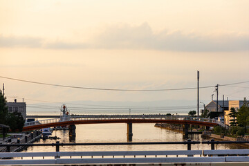 Naklejka premium Scenery of Iwase canal and Toyama townscape at sunset.
