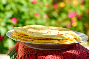 Bakery. Home made pancakes with   organic free range  eggs and white cheese on wooden background. Rustic style breakfast
