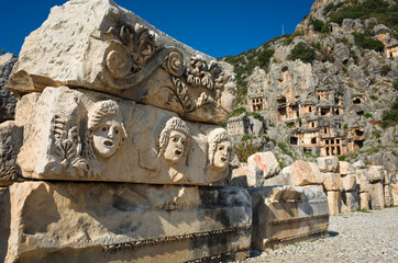 Ruins of ancient city of Myra in Demre, Turkey. Theatrical masks and faces relief and ancient rock...