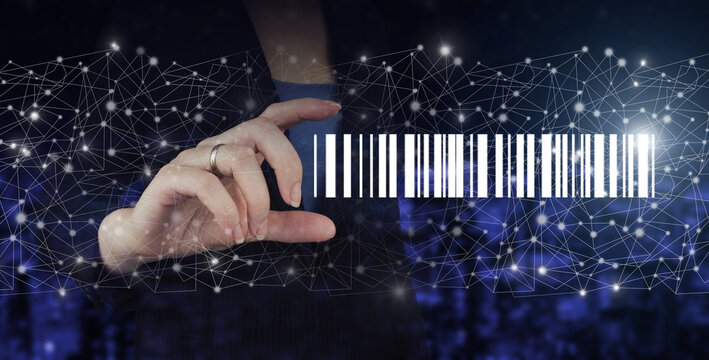 Bar Code Price Tag Merchandise Concept. Hand hold digital hologram Bar Code Price Tag sign on city dark blurred background. Inventory Logistics Concept