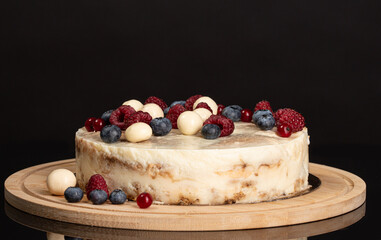 Tiramisu cake with a coffee cup on the black background