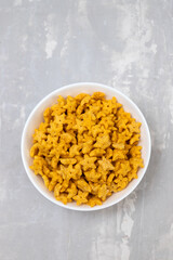 sweet yellow corn flakes in white small bowl