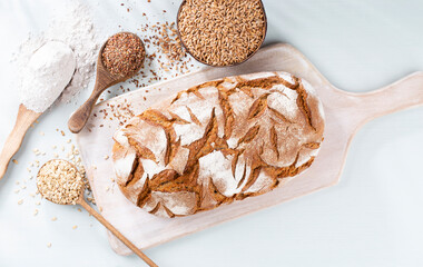 Sliced rye bread on cutting board, closeup..