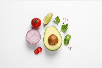 Fresh ingredients for guacamole on white background, flat lay