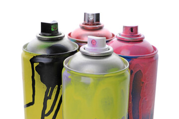 Used cans of spray paints on white background. Graffiti supplies