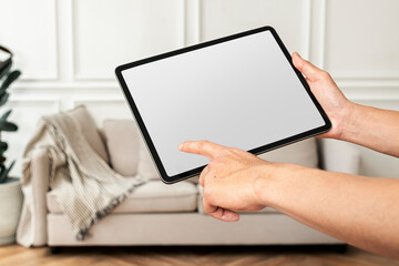Woman using a tablet with blank screen