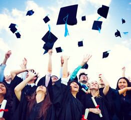 Graduating students throwing hats in the air