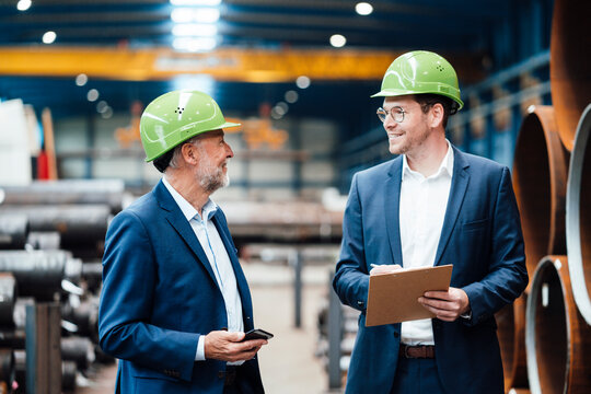 Male managers having discussion at warehouse