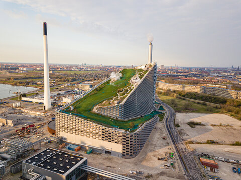 Copenhagen, Denmark - April 12, 2020: Aerial drone view of Amager Bakke, a waste to power plant with a ski slope on top.