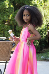 cute mixed girl eating an ice cream