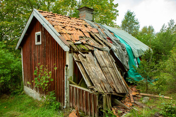 old wooden broken house in the forest © Molnets Broder