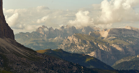hazy afternoon landscape view toward val gardena from Passo di Sella in the italian Dolomites