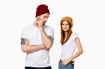 young couple in white t-shirts fashion posing studio