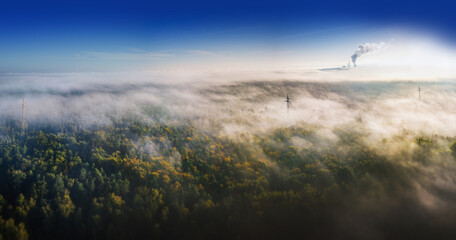 nature and industry - misty landscape from above with you on the power station