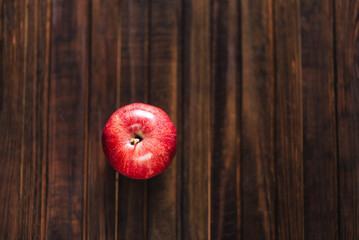 red apple on wooden background