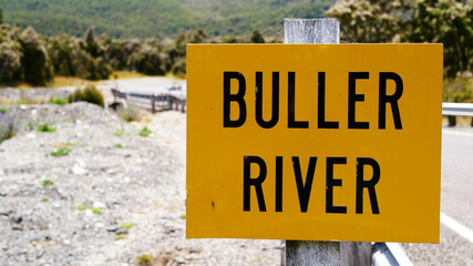 Buller River sign on the South Island of New Zealand. One of the country's longest rivers, it flows from Lake Rotoiti through the Buller Gorge and into the Tasman Sea near the town of Westport.