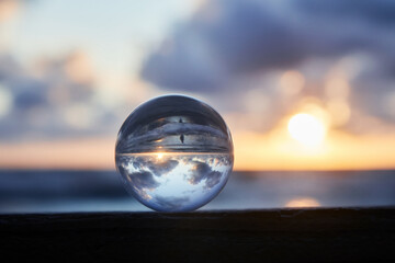 Magic sphere. Fortune teller, mind power concept. Crystal Ball reflecting water and sky.