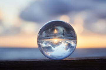 Magic sphere. Fortune teller, mind power concept. Crystal Ball reflecting water and sky.