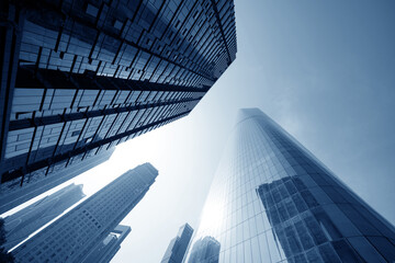 Common modern business skyscrapers, high-rise buildings, architecture raising to the sky, sun....