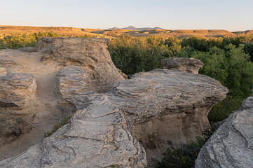 Sunrise over Writing on Stone Provincial Park and Sweet Grass Hills in Alberta, Canada