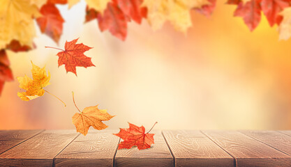 autumn leaves falling on wooden table