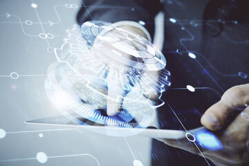 Multi exposure of man's hand holding and using a digital device and data theme drawing. Innovation...