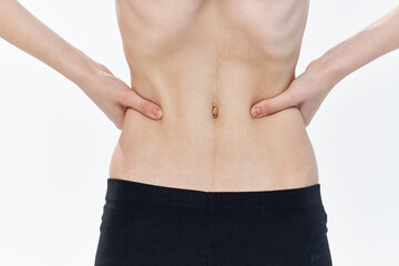 Fototapeta na wymiar female flat belly anorexia diet health problems