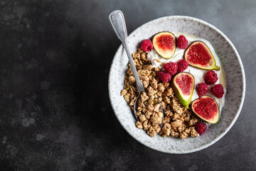 Greek yogurt with granola, figs, raspberries and honey.